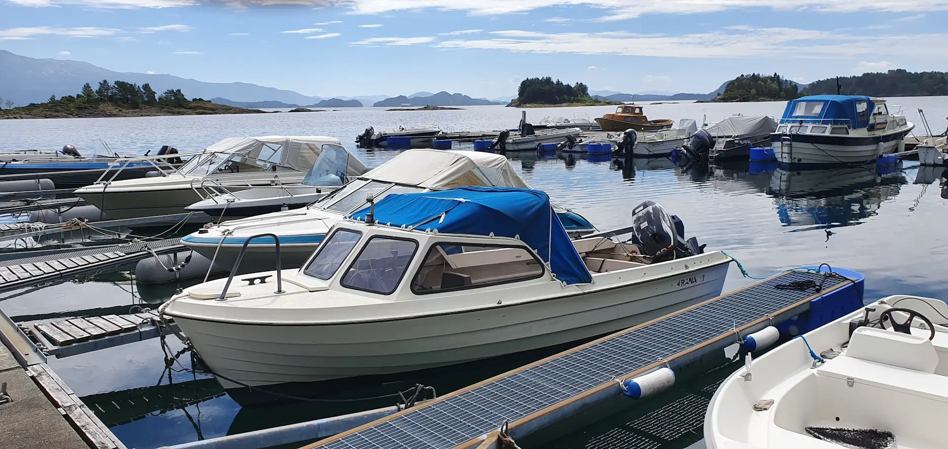 A number of small boats in a body of water